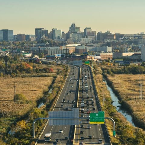 Aerial view of highway leading into city landscape of Wilmington, DE